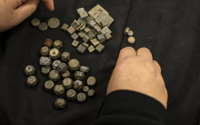 Ancient weights seized during the search of a home in Afula, July 7, 2022. (Yoli Schwartz/IAA)