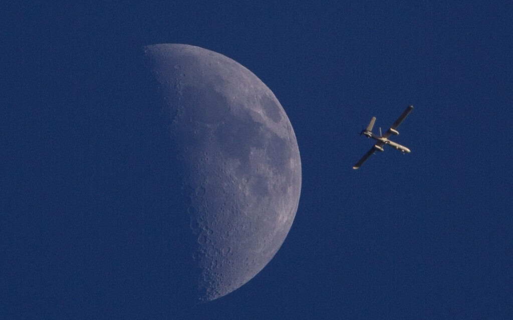 File: In this August 3, 2014 photo, an armed Israeli drone circles over Gaza City. (AP Photo/Dusan Vranic)