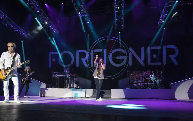 The British-American rock band Foreigner with founder and lead guitarist Mick Jones, from left, guitarist Bruce Watson, keyboardist Michael Bluestein, lead vocalist Kelly Hansen and drummer Chris Frazier performs at the Blue Hills Bank Pavilion as part of The Juke Box Heroes Tour, Wednesday, June 20, 2018, in Boston. (Photo by Robert E. Klein/Invision/AP)