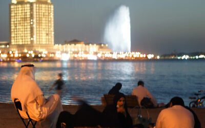 Visitors watch the landmark King Fahd's Fountain in Jeddah, Saudi Arabia on Jan. 15, 2021. (AP Photo/Amr Nabil)