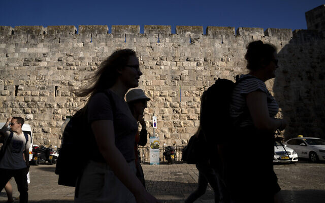 Tourists visit the Old City of Jerusalem, Wednesday, June 15, 2022. (AP Photo/Maya Alleruzzo)