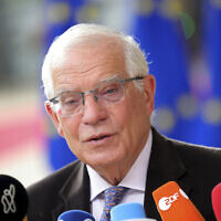 European Union foreign policy chief Josep Borrell speaks with the media as he arrives for an EU summit in Brussels, on June 23, 2022. (AP Photo/Olivier Matthys)