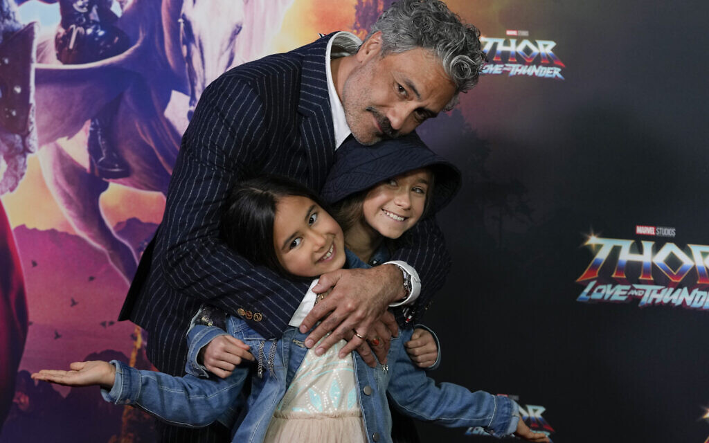 New Zealand director Taika Waititi poses for a photo with his daughter's Matewa Kiritapu and Te Hinekahu during a red carpet event for the movie premiere of 'Thor: Love and Thunder' at the Entertainment Quarter in Sydney, Australia, June 27, 2022. (AP Photo/Mark Baker)