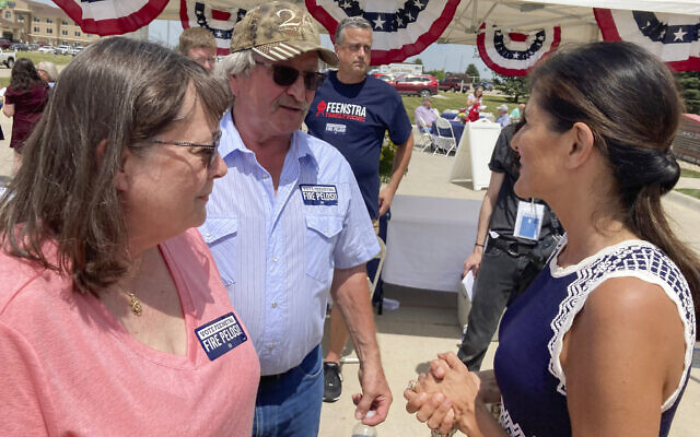 Former US ambassador to the UN Nikki Haley talks with Bob and Kathy de Koning, a farming couple from Sioux County, Iowa, June 30, 2022, after headlining a fundraiser in northwest Iowa for Republican Representative Randy Feenstra. (AP Photo/Tom Beaumont)