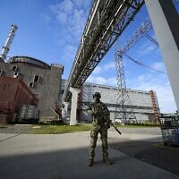 A Russian serviceman guards in an area of the Zaporizhzhia Nuclear Power Station in territory under Russian military control, southeastern Ukraine, Sunday, May 1, 2022. (AP Photo, File)