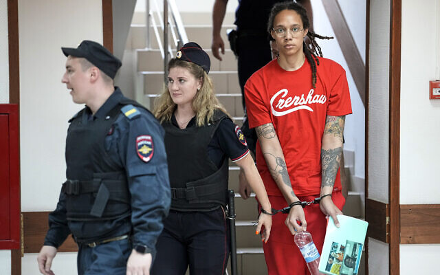 WNBA star and two-time Olympic gold medalist Brittney Griner is escorted to a courtroom for a hearing, in Khimki just outside Moscow, Russia, July 7, 2022  (AP Photo/Alexander Zemlianichenko)