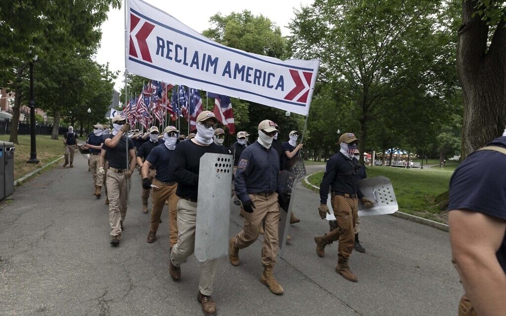 Marchers bearing the insignia of the white supremacist group Patriot Front parade through Boston Common on July 2, 2022, in Boston. (AP Photo/Michael Dwyer)
