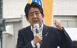 In this image from a video, Japan’s former Prime Minister Shinzo Abe makes a campaign speech in Nara, western Japan shortly before he was shot, July 8, 2022. (Kyodo News via AP)