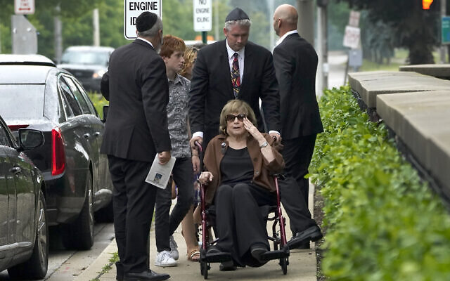 Linda Straus, widow of Stephen Straus, who was killed Monday in a mass shooting at the Fourth of July parade in Highland Park arrives for a funeral service with family members at the Jewish Reconstructionist Congregation, July 8, 2022, in Evanston, Illinois (AP Photo/Charles Rex Arbogast)