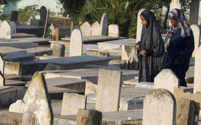 Palestinians visit their relatives' graves at Gaza cemetery on the first day of Eid al-Adha in Gaza City, July 9, 2022. (AP Photo/Adel Hana)