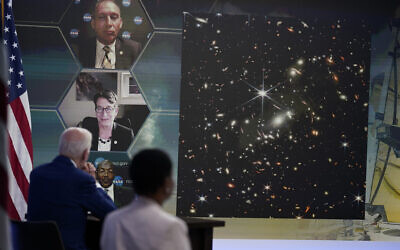 US President Joe Biden listens during a briefing from NASA officials about the first images from the Webb Space Telescope, the highest-resolution images of the infrared universe ever captured, in the South Court Auditorium on the White House complex, July 11, 2022, in Washington. (AP Photo/Evan Vucci)