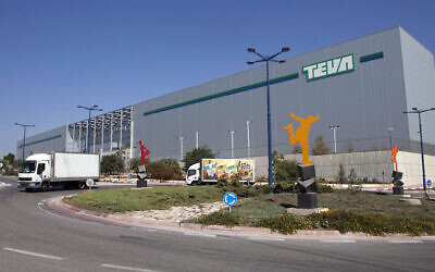Trucks drive in front of Teva Pharmaceutical Logistic Center in the town of Shoam, Israel, on October 16, 2013. (Dan Balilty/AP)