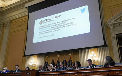 A tweet from former president Donald Trump is shown as the House select committee investigating the Jan. 6 attack on the US Capitol holds a hearing at the Capitol in Washington, July 12, 2022. (AP Photo/J. Scott Applewhite)