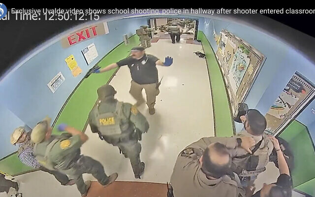 In this photo from surveillance video provided by the Uvalde Consolidated Independent School District via the Austin American-Statesman, authorities respond to the shooting at Robb Elementary School in Uvalde, Texas, Tuesday, May 24, 2022. (Uvalde Consolidated Independent School District/Austin American-Statesman via AP)
