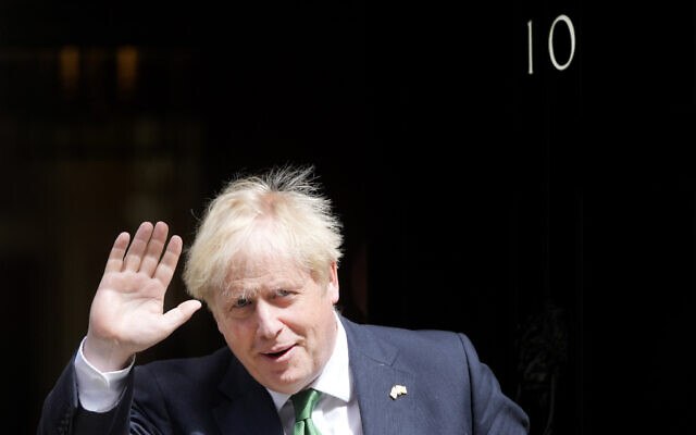 Britain's Prime Minister Boris Johnson leaves 10 Downing Street to attend the weekly Prime Ministers' Questions session in parliament in London, Wednesday, July 13, 2022. (AP/Frank Augstein)