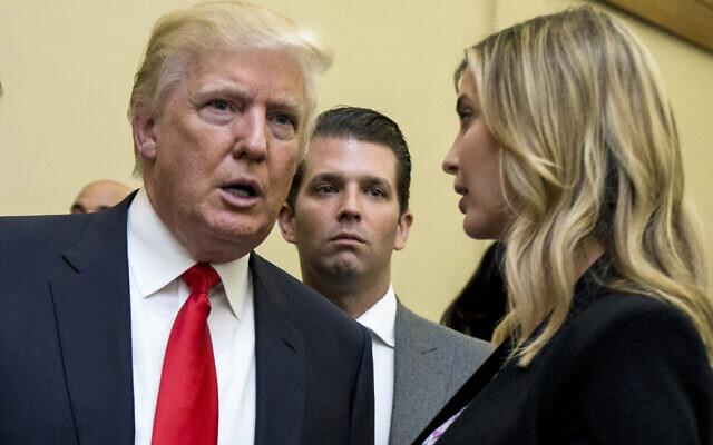 Donald Trump, left, his son Donald Trump Jr., center, and his daughter Ivanka Trump speak during the unveiling of the design for the Trump International Hotel, in Washington, September 10, 2013. (AP Photo/Manuel Balce Ceneta, File)