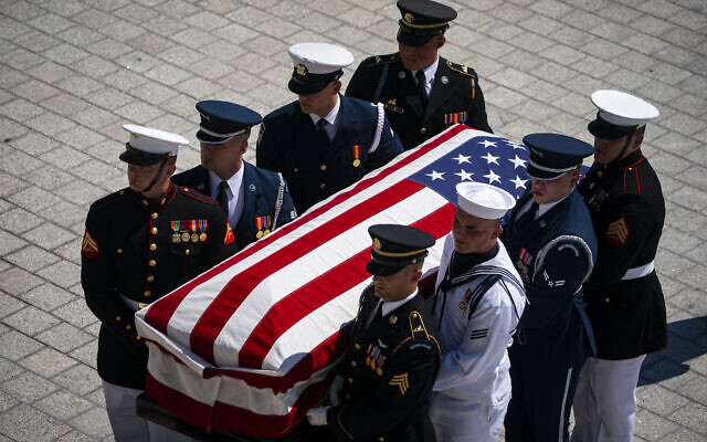 The flag-draped casket bearing the remains of Hershel W. 'Woody' Williams is carried by joint service members into the US Capitol, July 14, 2022 in Washington, to lie in honor. (Al Drago/Pool Photo via AP)