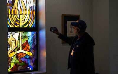 A stained glass window that once had bullet holes is now repaired at Congregation Beth Israel in Colleyville, Texas, April 7, 2022. (AP Photo/LM Otero, File)