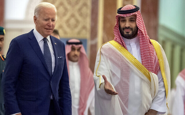 Saudi Crown Prince Mohammed bin Salman, right, welcomes US President Joe Biden upon his arrival at Al-Salam palace in Jeddah, Saudi Arabia, July 15, 2022. (Bandar Aljaloud/Saudi Royal Palace via AP)