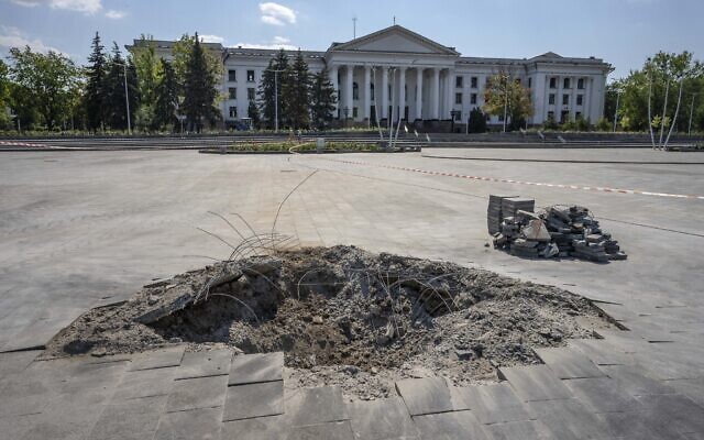 A crater in the aftermath of a Russian missile strike, in front of the city council hall building, in Kramatorsk city hall, eastern Ukraine, July 16, 2022. (AP Photo/Nariman El-Mofty)