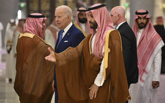 US President Joe Biden, center left, and Saudi Crown Prince Mohammed bin Salman, center, arrive for the family photo during the GCC+3 (Gulf Cooperation Council) meeting at a hotel in Saudi Arabia's Red Sea coastal city of Jeddah, Saturday, July 16, 2022. (Mandel Ngan/Pool Photo via AP)