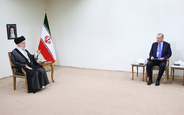 Supreme Leader Ayatollah Ali Khamenei, left, speaks during his meeting with Turkish President Recep Tayyip Erdogan, right, as Iranian President Ebrahim Raisi sits at right, unseen, in Tehran, Iran, July 19, 2022. (Office of the Iranian Supreme Leader via AP)