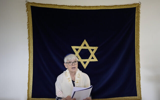 Rabbi Barbara Aiello reads prayers in her 'Ner Tamid del Sud' (The Eternal Light of the South) synagogue in Serrastretta, southern Italy, July 8, 2022 (AP Photo/Andrew Medichini)