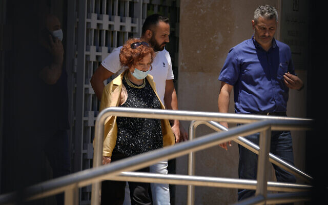 Lebanese Judge Ghada Aoun, left, leaves the Central Bank following a raid to pursue embattled Central Bank Governor Riad Salameh on corruption charges in Beirut, Lebanon, July 19, 2022. (AP Photo/Bilal Hussein)