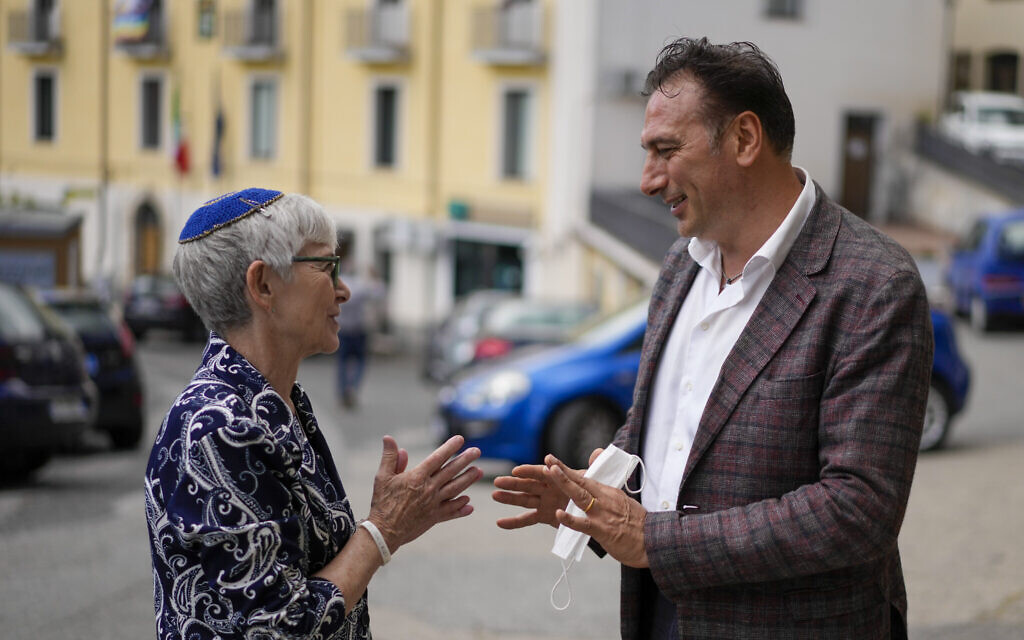 Rabbi Barbara Aiello, left, talks with Serrastretta mayor Antonio Muraca, in Serrastretta, southern Italy, July 8, 202 (AP Photo/Andrew Medichini)
