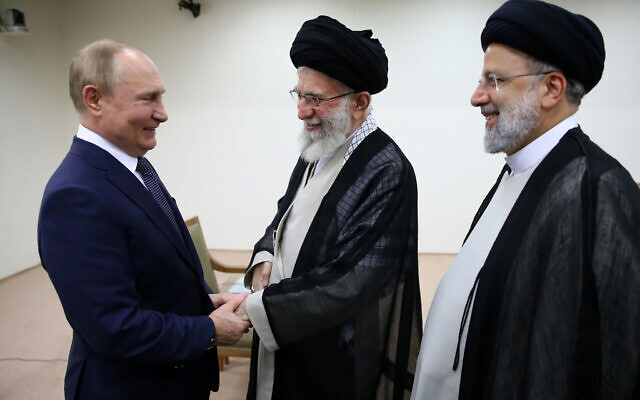 Supreme Leader Ayatollah Ali Khamenei, center, and Russian President Vladimir Putin, left, greet each other as Iranian President Ebrahim Raisi stands at right, during their meeting in Tehran, Iran, July 19, 2022. (Office of the Iranian Supreme Leader via AP)