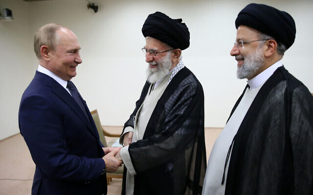 Supreme Leader Ayatollah Ali Khamenei, center, and Russian President Vladimir Putin, left, greet each other as Iranian President Ebrahim Raisi stands at right, during their meeting in Tehran, Iran, July 19, 2022. (Office of the Iranian Supreme Leader via AP)