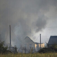 A blaze in the village of Wennington, east London, July 19, 2022 (Yui Mok/PA via AP)