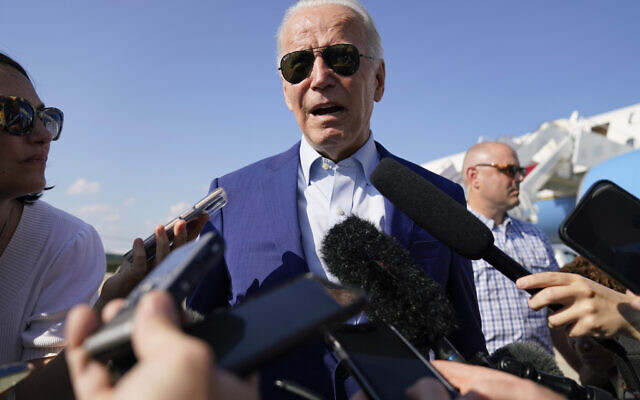 US President Joe Biden speaks to members of the media after exiting Air Force One, July 20, 2022, at Andrews Air Force Base, Maryland. (AP Photo/Evan Vucci)