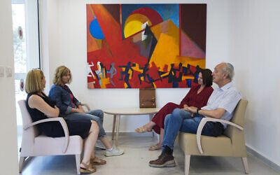 Ukrainian mental health professionals sit with Israeli clinical psychologist Dr. Danny Brom, right, at the Herzog Medical Center in Jerusalem, July 20, 2022. (AP Photo/Tsafrir Abayov)