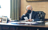 Illustrative: US President Joe Biden talks on the phone with his national security team from the Treaty Room in the residence of the White House in Washington, July 22, 2022. (Adam Schultz/The White House via AP)