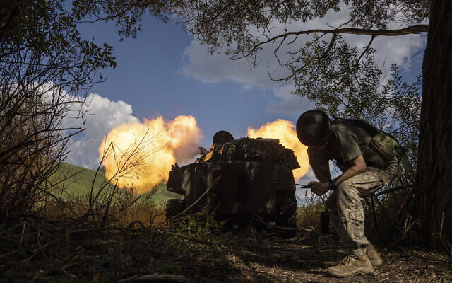 Ukrainian artillery fire is directed toward Russian forces at a frontline in Kharkiv region, Ukraine, July 27, 2022. (AP Photo/Evgeniy Maloletka)