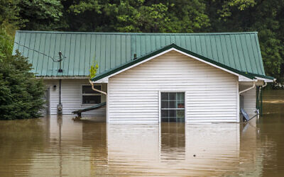 Homes are flooded by Lost Creek, Kentucky, July 28, 2022. (Ryan C. Hermens/Lexington Herald-Leader via AP)