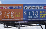 A sign displays the Mega Millions lottery jackpot in Detroit, July 29, 2022. (AP Photo/Paul Sancya)