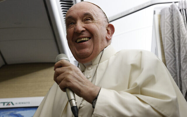Pope Francis speaks to journalists aboard the papal flight back from Canada, Saturday, July 30, 2022, where he paid a six-day pastoral visit. (Guglielmo Mangiapane/Pool via AP)