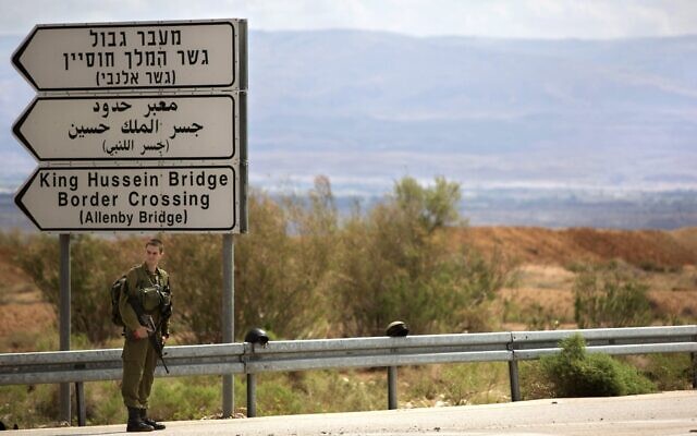An Israeli soldier stands at the entrance to the Allenby border crossing, the main border crossing for Palestinians from the West Bank traveling to neighboring Jordan and beyond, Monday, March 10, 2014. (AP/Sebastian Scheiner)
