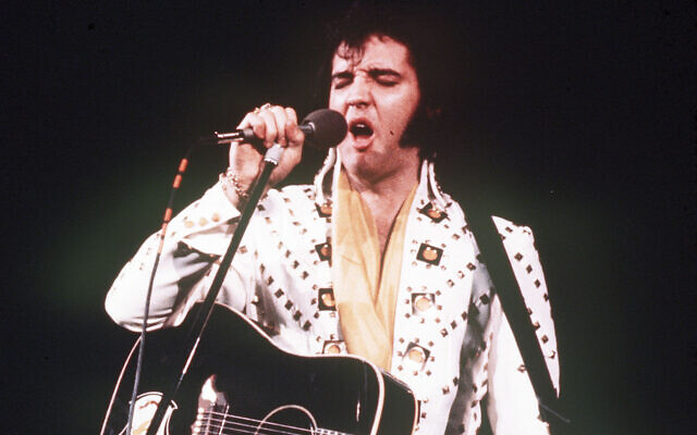 Elvis Presley performs on stage in an unspecified location, 1973. (AP Photo)