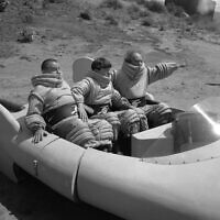 The Three Stooges, Joe DeRita, as "Curly," left, Moe Howard, center, and Larry Fine, are shown in a scene from the movie, "Have Rocket, Will Travel" in Los Angeles, California, May 25, 1959. (AP Photo/Ed Widdis)