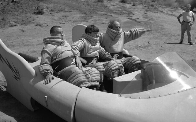 The Three Stooges, Joe DeRita, as "Curly," left, Moe Howard, center, and Larry Fine, are shown in a scene from the movie, "Have Rocket, Will Travel" in Los Angeles, California, May 25, 1959. (AP Photo/Ed Widdis)