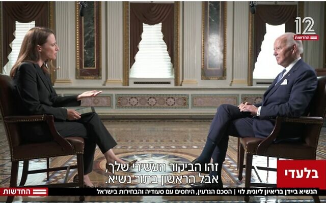 Screen capture from video of US President Joe Biden, left, speaking with Channel 12 News anchor Yonit Levi at the White House in Washington, in an interview broadcast July 13, 2022. (Channel 12 News)