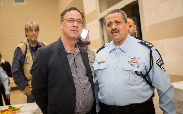 Outgoing Israel Police chief Roni Alsheich (right) with State Prosecutor Shai Nitzan during a farewell ceremony in his honor in Beit Shemesh on November 29, 2018. (Yonatan Sindel/Flash90)
