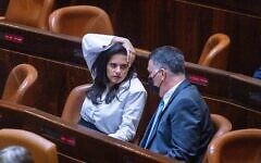 Yamina MK Ayelet Shaked (L) speaks with New Hope head Gideon Sa'ar at the Knesset in Jerusalem, June 2, 2021 (Olivier Fitoussi/Flash90)