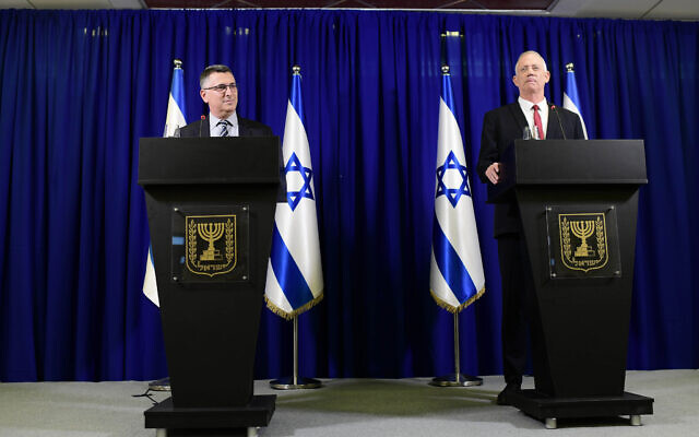 Justice Minister Gideon Saar and Defense Minister Benny Gantz hold a press conference announcing a merger of their parties, July 10, 2022. (Tomer Neuberg/Flash90)