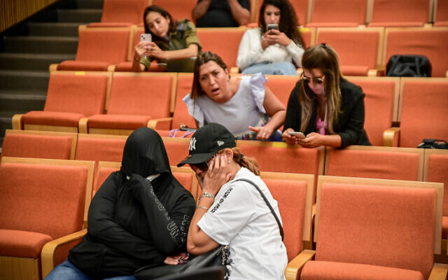 Parents of children abused in a Holon daycare center sit behind the two accused former daycare employees at the District Court in Tel Aviv, July 20, 2022 (Photo by Avshalom Sassoni/Flash90)