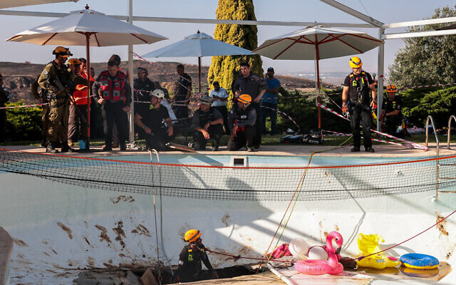 Rescue teams at the site where a sinkhole opened up in a pool at a home in Karmei Yosef, July 21, 2022. (Yossi Aloni/Flash90)