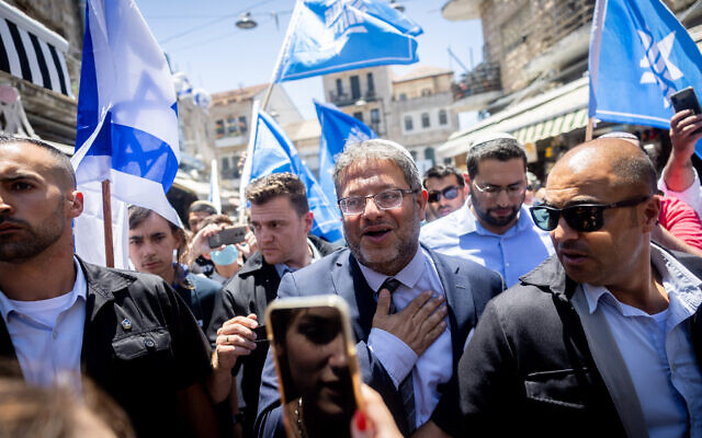 MK Itamar Ben Gvir of the far right Otzma Yehudit party tours the Mahane Yehuda market in Jerusalem on July 22, 2022. (Yonatan Sindel/Flash90)
